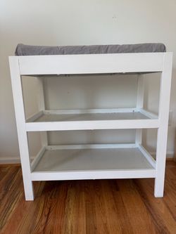 White changing table and pad included