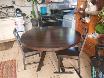 Brown Wood Dining Table And Chair Set.