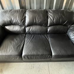 Black leather sofa and oversized chair