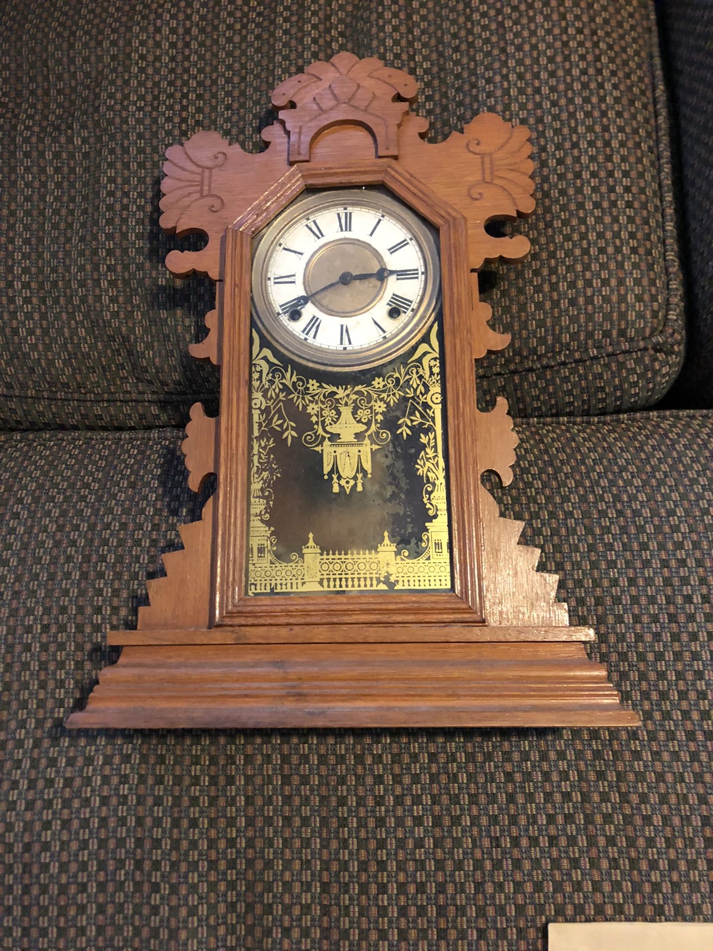 Beautiful old clock has key in pendulum.