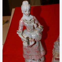 Victorian porcelain lady statue about 8 inches tall, golden pink