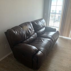  Ashley’s Furniture Wide Brown Authentic Leather W/ 1 Reclining Seat. Right Seat Power Reclines