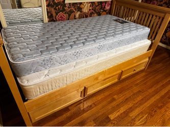 Twin trundle bed with 2 mattresses in oak finish