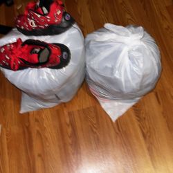 Two Bags Of Men’s Clothing  With Pair Of Shoes 