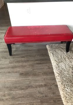 Cute Red leather bench With Studs Around It 
