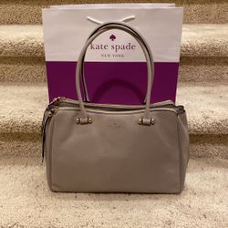 Kate Spade Luxurious Leather Double Zipper Grey/Taupe Handbag. New With Tag. New With Tag. Paid $485. Sell $125.