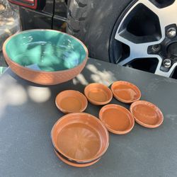 Terracotta planter and saucers