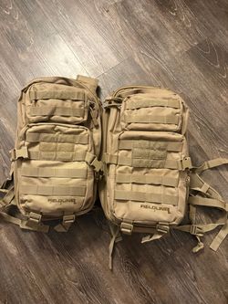 Two coyote tan backpacks