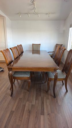 Large dining room table with 10 chairs