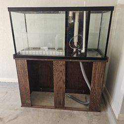 90 Gallon fish tank with Stand. Sump and Protein skimmer with some extra attachments (no lights included)
