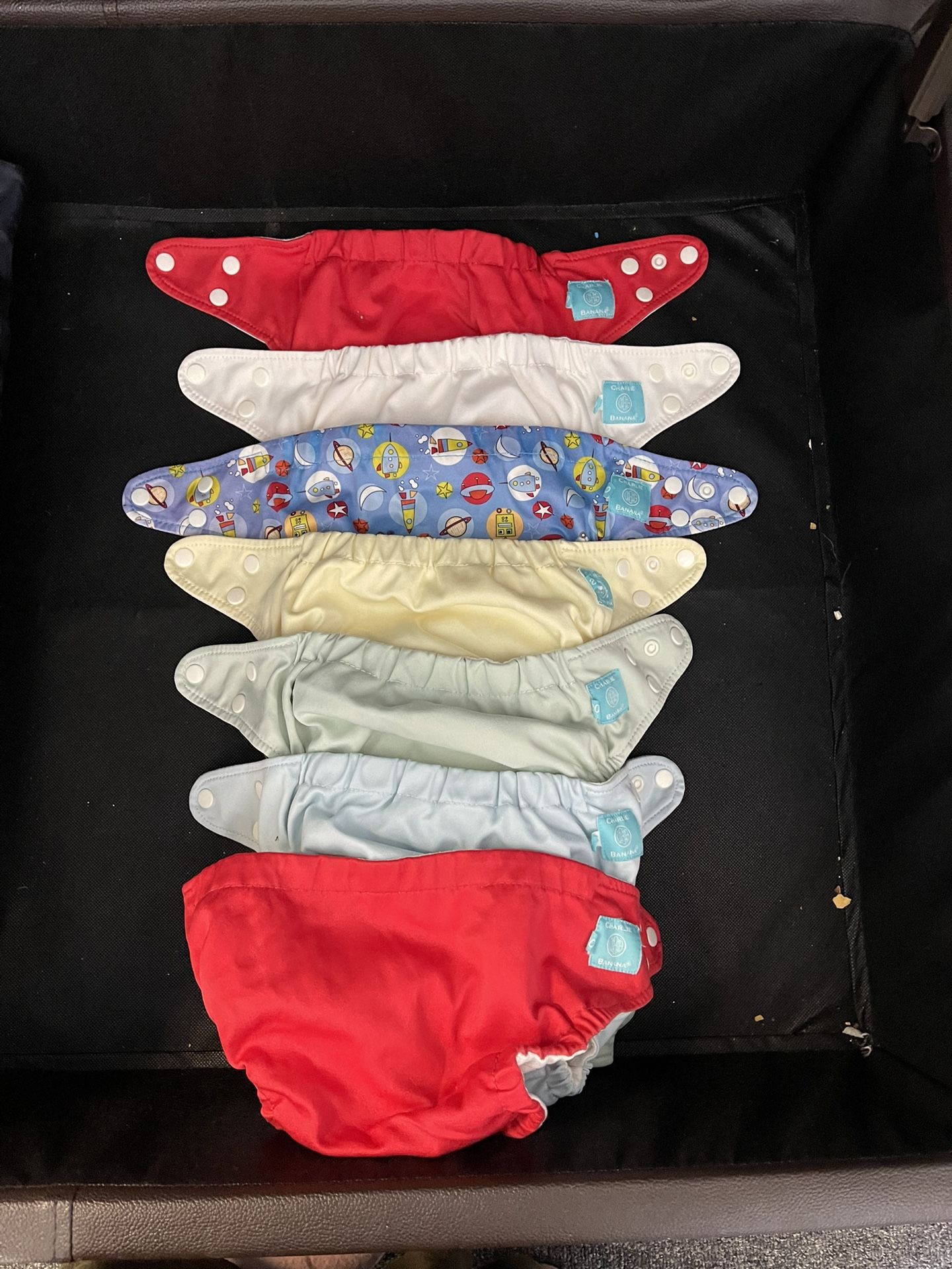 Charlie banana Clothe Diapers 7 clothe diapers - may need elastic replacement 22 extra reusable inserts Lots of baby items available and not posted