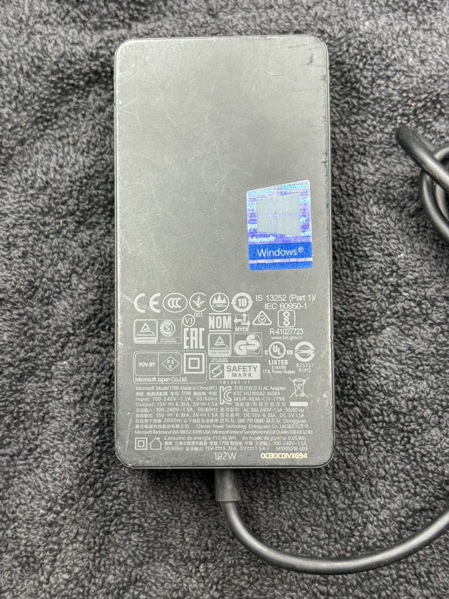 Microsoft Surface Power Supply, specifically model 1798 with a 102W output.