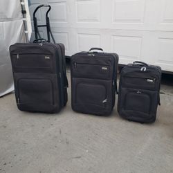 Suitcase - 2 available- Large,   or carry on size  - $20 each