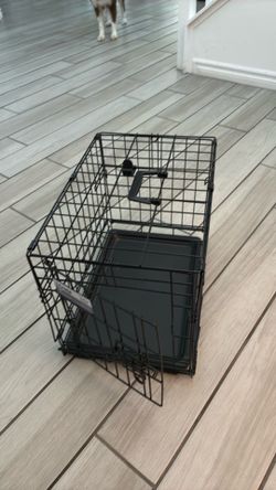 black metal wire dog crat