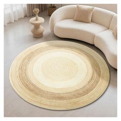 +1                    This braided rug features a natural, rustic design with concentric rings in shades of beige and brown.Material: It is typically 