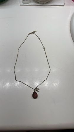 Stone necklaces with a small tiny bird 🐦 on it has a brand on it