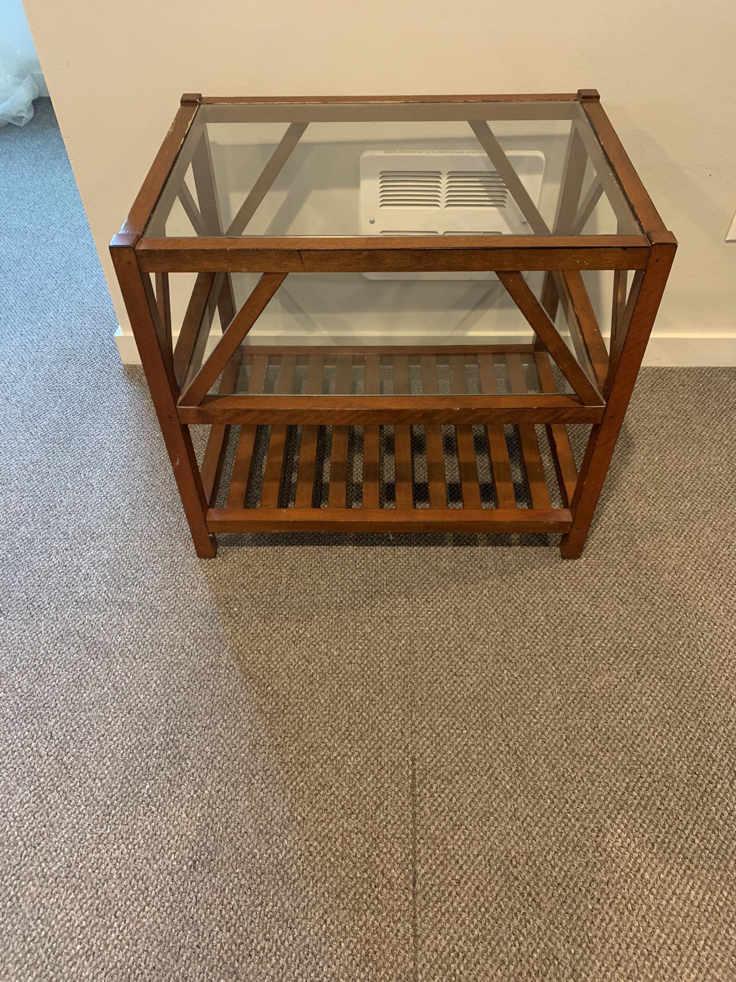 Three tier wooden side table with glass top. In good condition coming from a pet and smoke-free home. Asking only $30   Dimensions: length -19inch x w