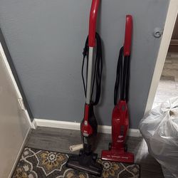 Two vacuums two different brands.