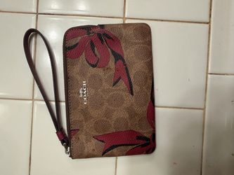 Coach signature floral wristlet