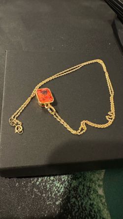 18k gold rope chain necklace with red gemstone