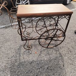 Elegant Vintage wrought iron wine cart , perfect for home decor. 
Unique!