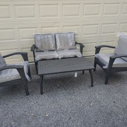 Outdoor patio wicker loveseat with chairs and coffee table 