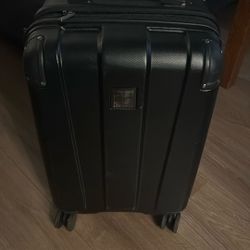 Kenith Cole Cary On Suitcase