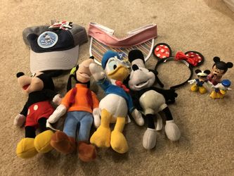 Lots of Disney stuff for sale, plush, Sun Visor, poster, figurines, hats, etc