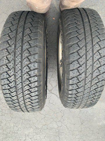 Two 255/70R18 Bridgestone dueler A/T tires with rims