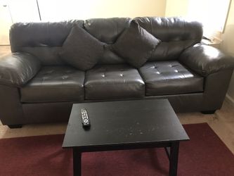 Brown leather sofa, three seater , very good condition along with pillows