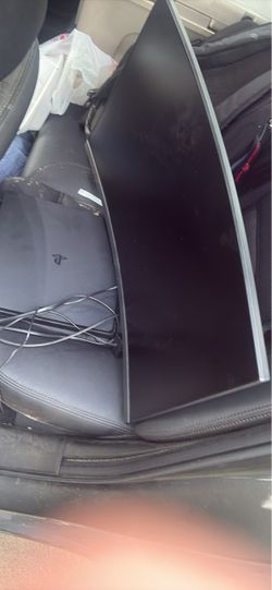 Curved computer monitor and PS4 slim with two controllers
