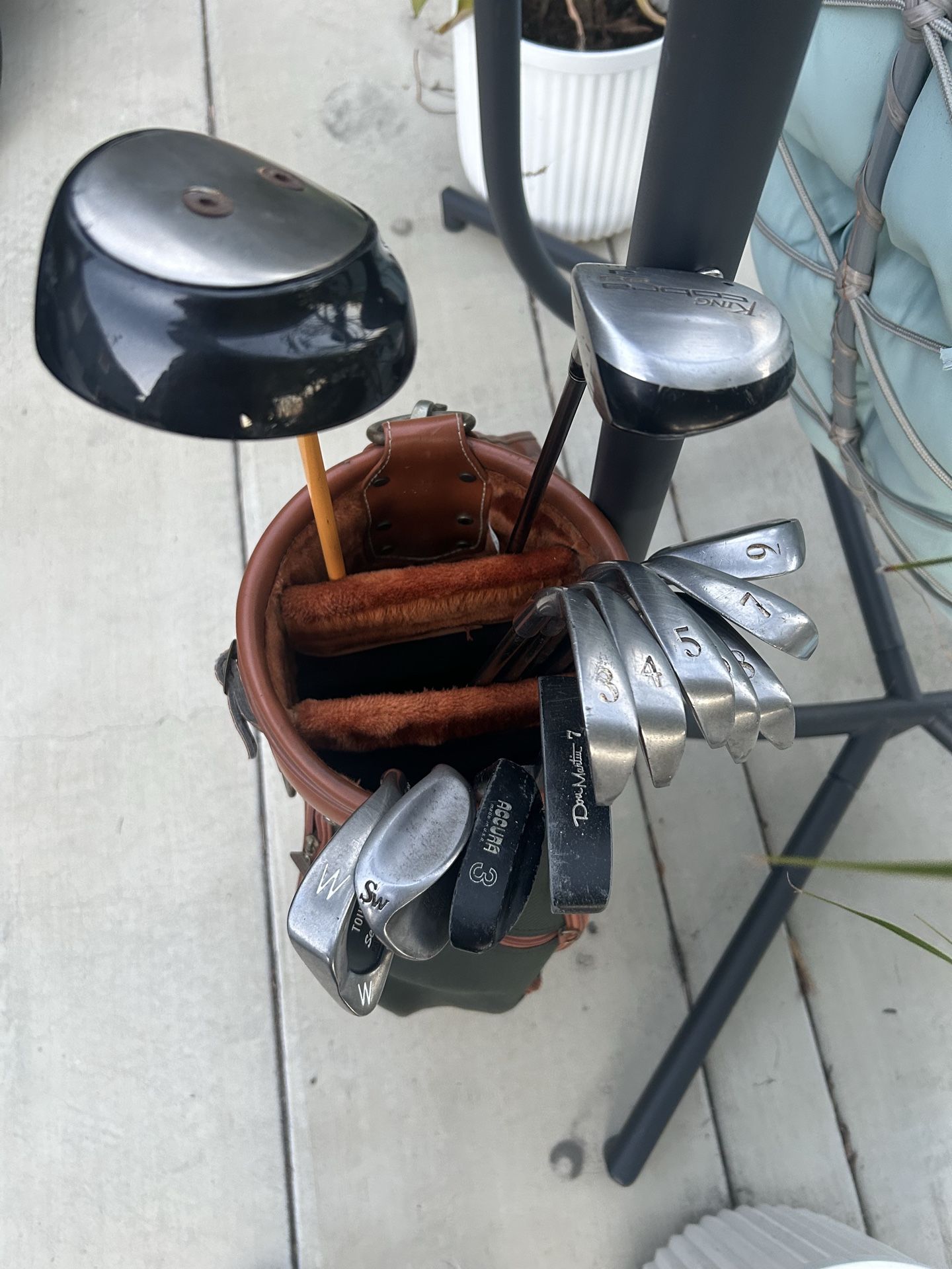 Full set golf clubs balls & tees.
