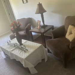 Two Brown Comfortable Chairs , Coffee table , Table In Between Chair & The One Under Tv . Not Selling TV 