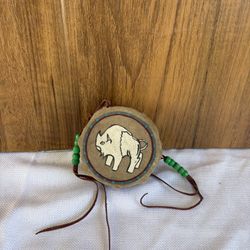Native American-style hand-painted buffalo drum medallion