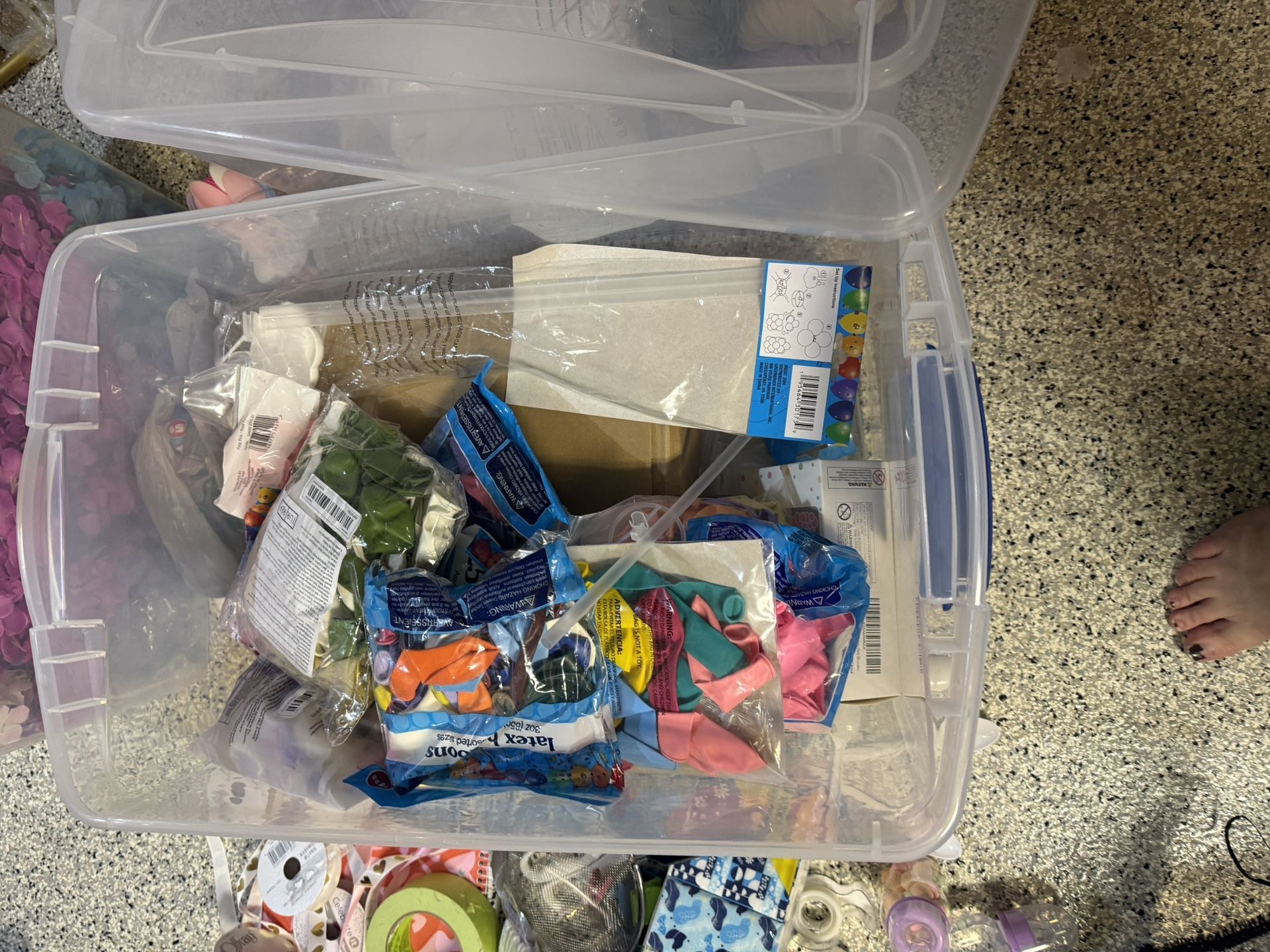 Container Of Balloons And Ballon Stands 