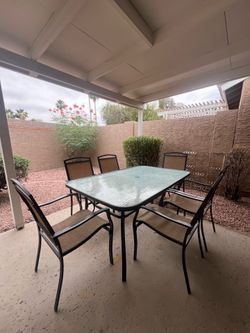 Outdoor Patio Set with Glass Table and 6 Lightweight Mesh Chairs
