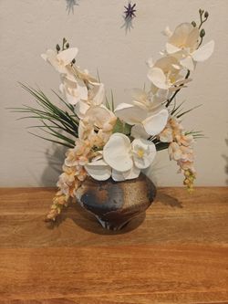 Forever flowers in beautiful vase. Champagne wisteria and orchid flowers