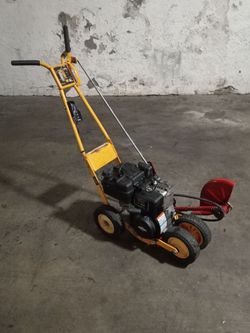 McLane 9 inc  3.5 hp gas powered walk behind land edge in excellent working condition