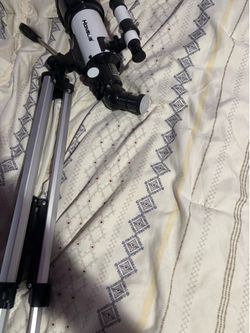 Telescope w/tripod and carrying case/extra adaptions all new