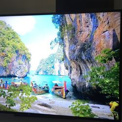 LG 70” 4K UHD Smart TV with Full Motion Wall Mount