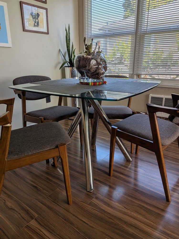 Modern Glass Table With Mid Century Chairs