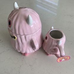PINK EYED MONSTER COOKIE JAR WITH MARCHING COFFEE MUG 