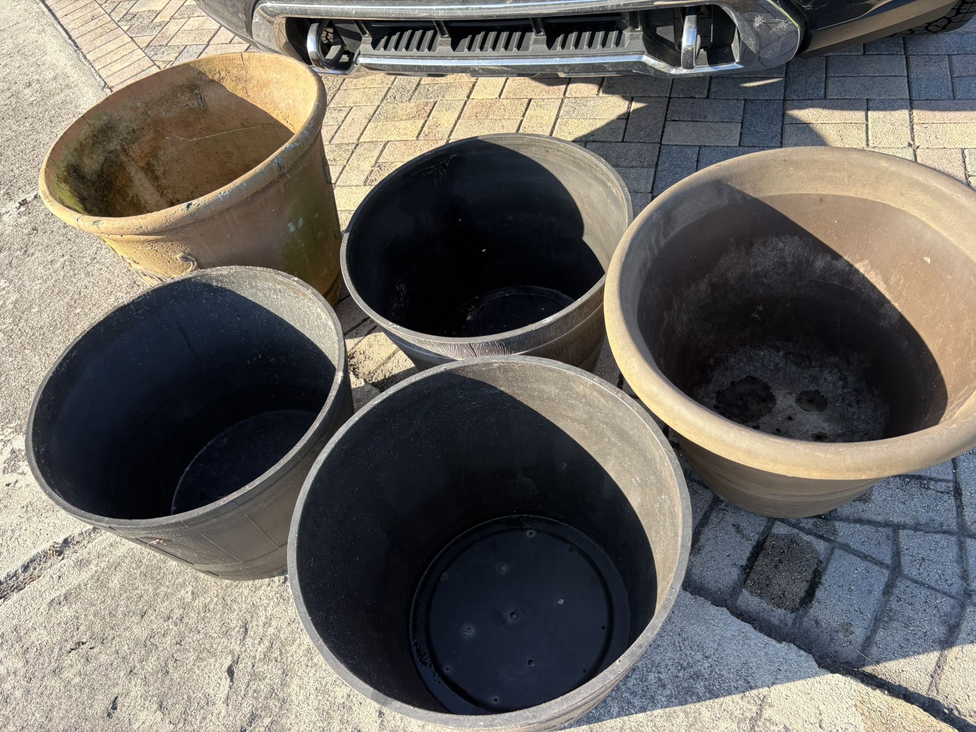 FIVE (5) LARGE OVERSIZED FLOWER OR TREE POTS WITH DRAIN HOLES.  3 Identical Black Planters & 2 Other Styles.  ALL 5 NOW ONLY $50 FIRM.  