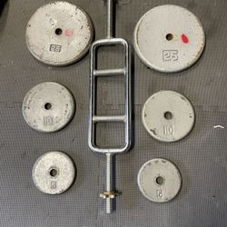 Weight Plates. Tricep Bar.    70 Dollars 