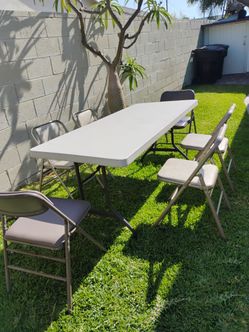 7' table and 6 cushion chairs