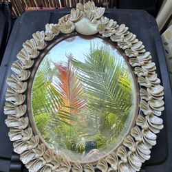 Antique mirror with shell boarder