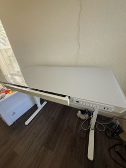 Glass standing desk with drawer