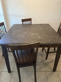 Black Marble Table With Four Chairs