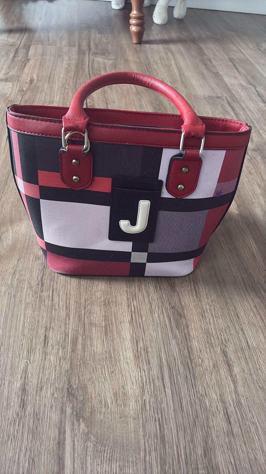 black, white, gray, purple pattern handbag and wallet