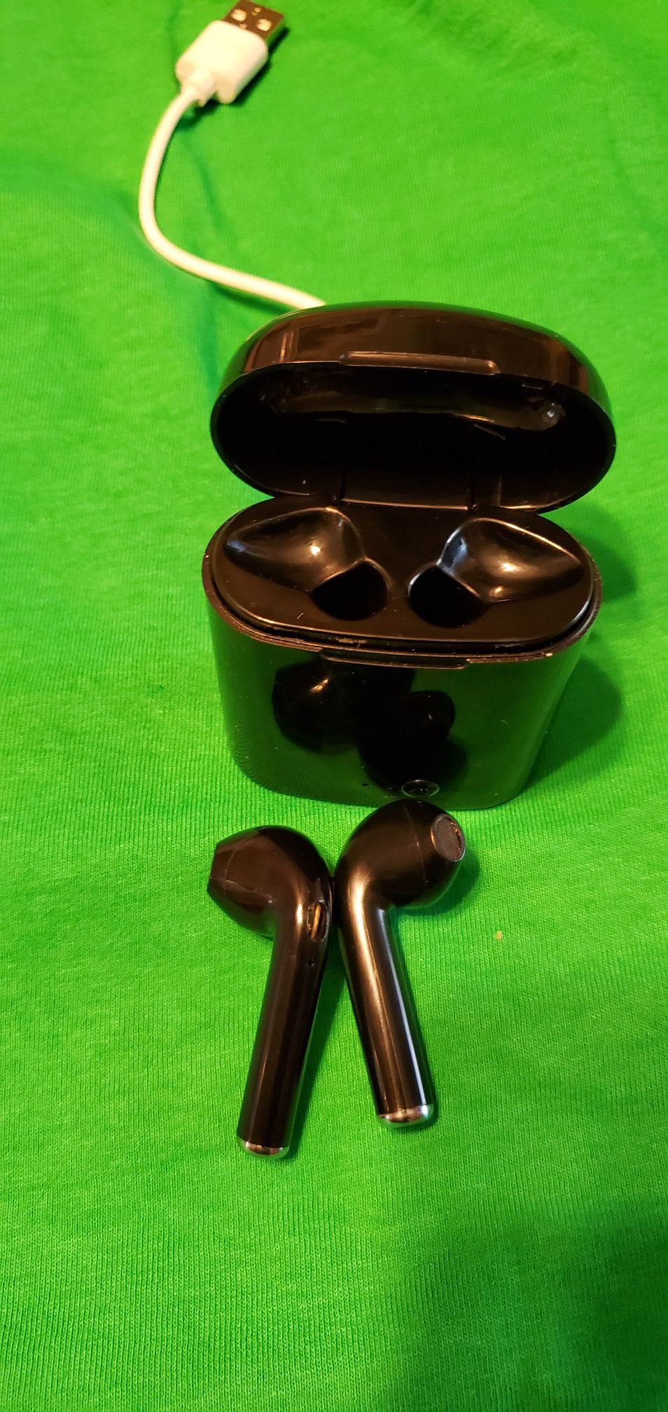 Wireless earbuds with charging case and cord